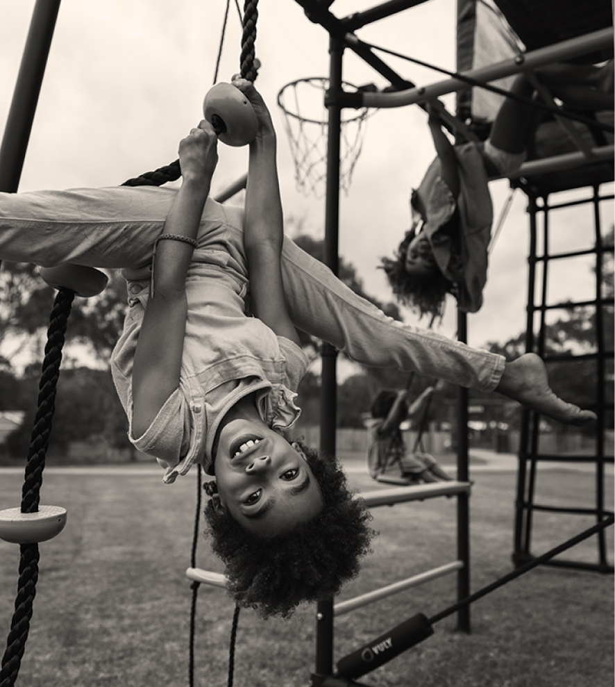 child hanging upside down