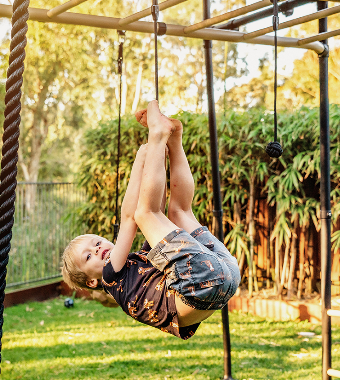 Child hanging on swing