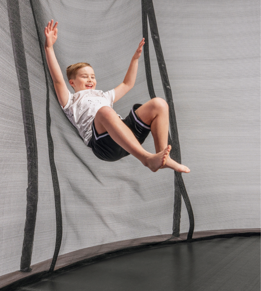 Child bouncing on a trampoline