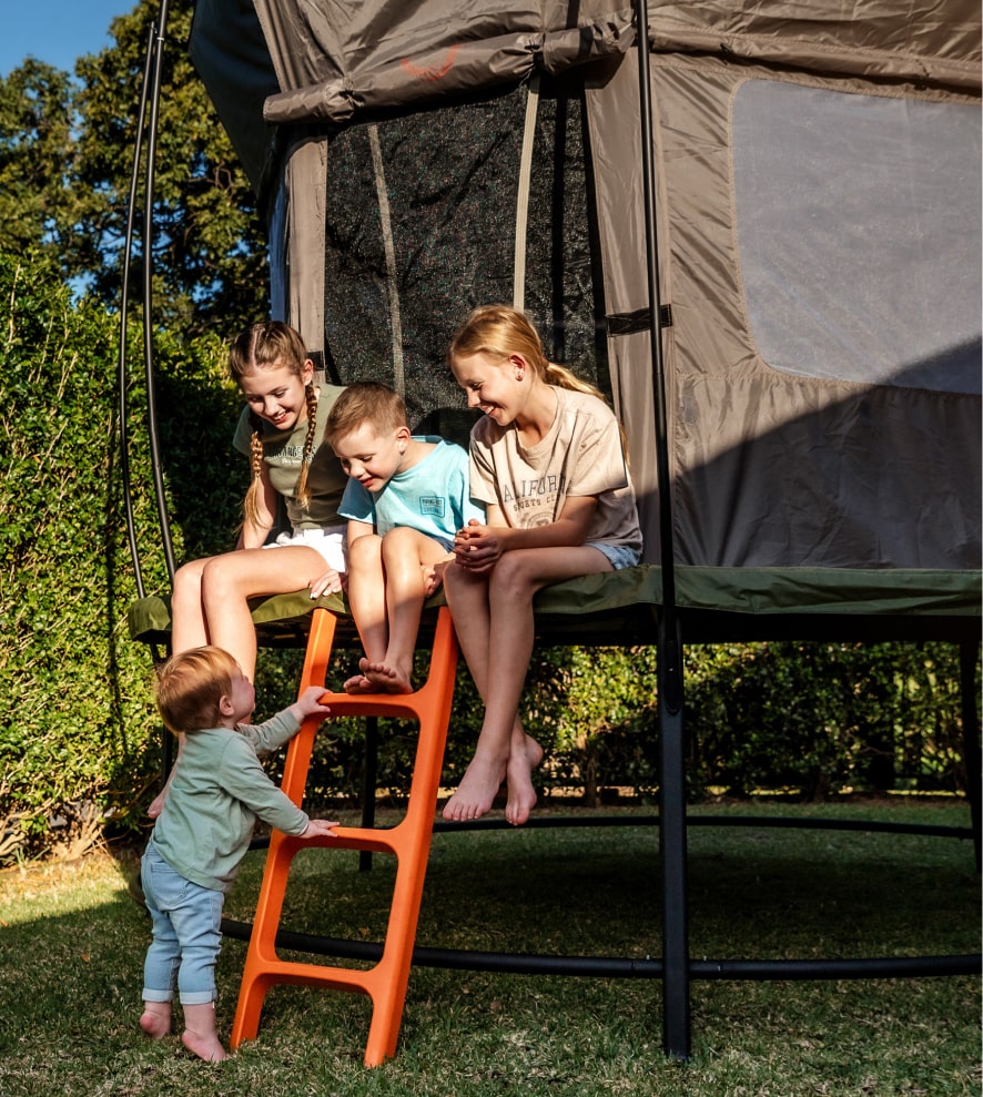 Children sitting on a trampoline