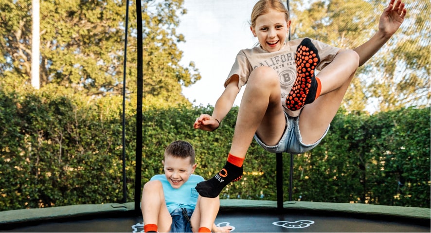 Kids bouncing on trampoline