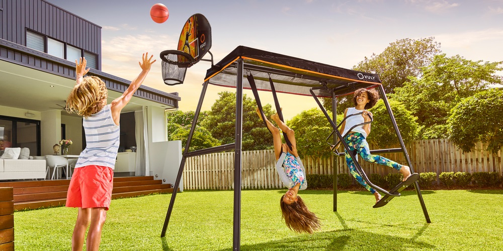 Kids playing outside on Max play equipment by Vuly Play