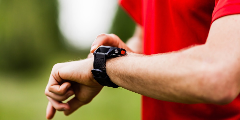 A man viewing his fitness watch