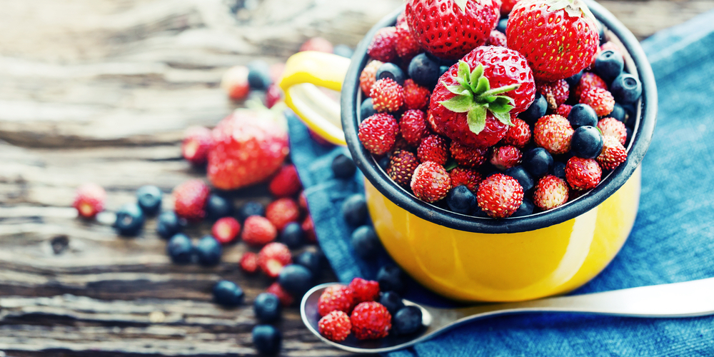 Different berries in a cup