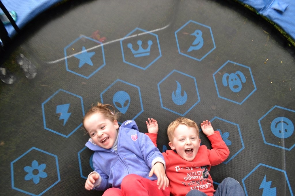 Kids laying on their back on Vuly trampoline