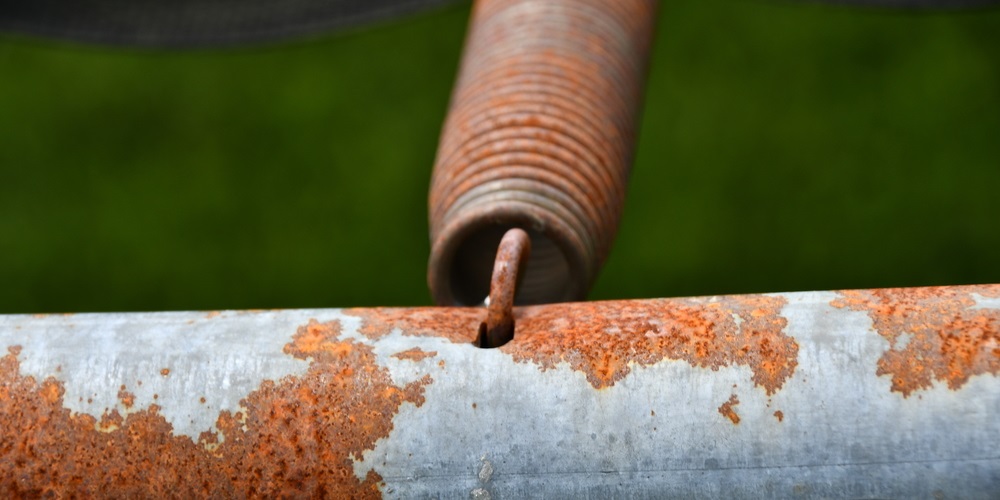 Up close of rusty trampoline springs