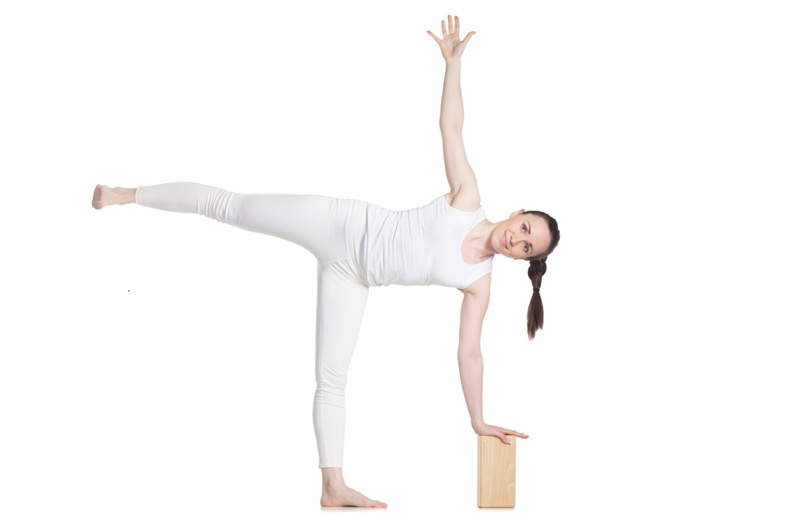 Woman in yoga half moon pose