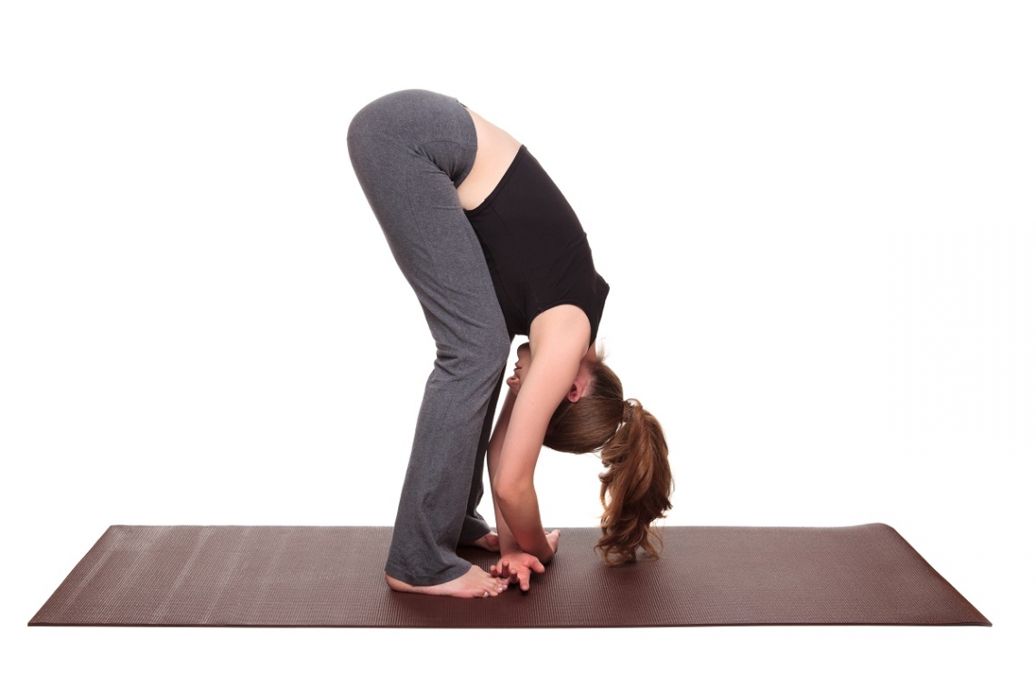 Woman in yoga ragdoll pose
