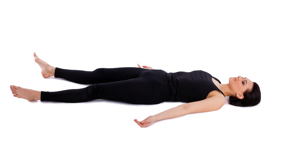 Woman in savasana yoga pose