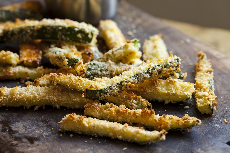 Zucchini chips served on plate