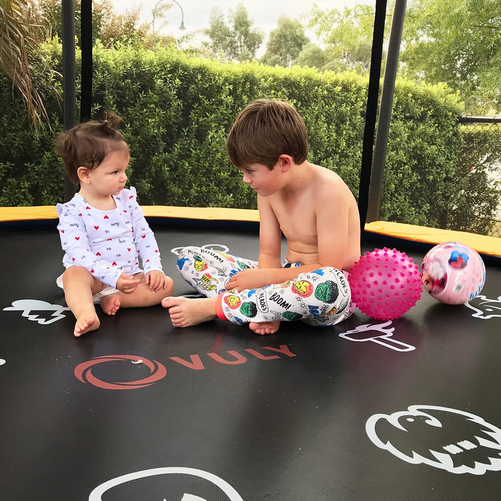 brother and sister on the trampoline