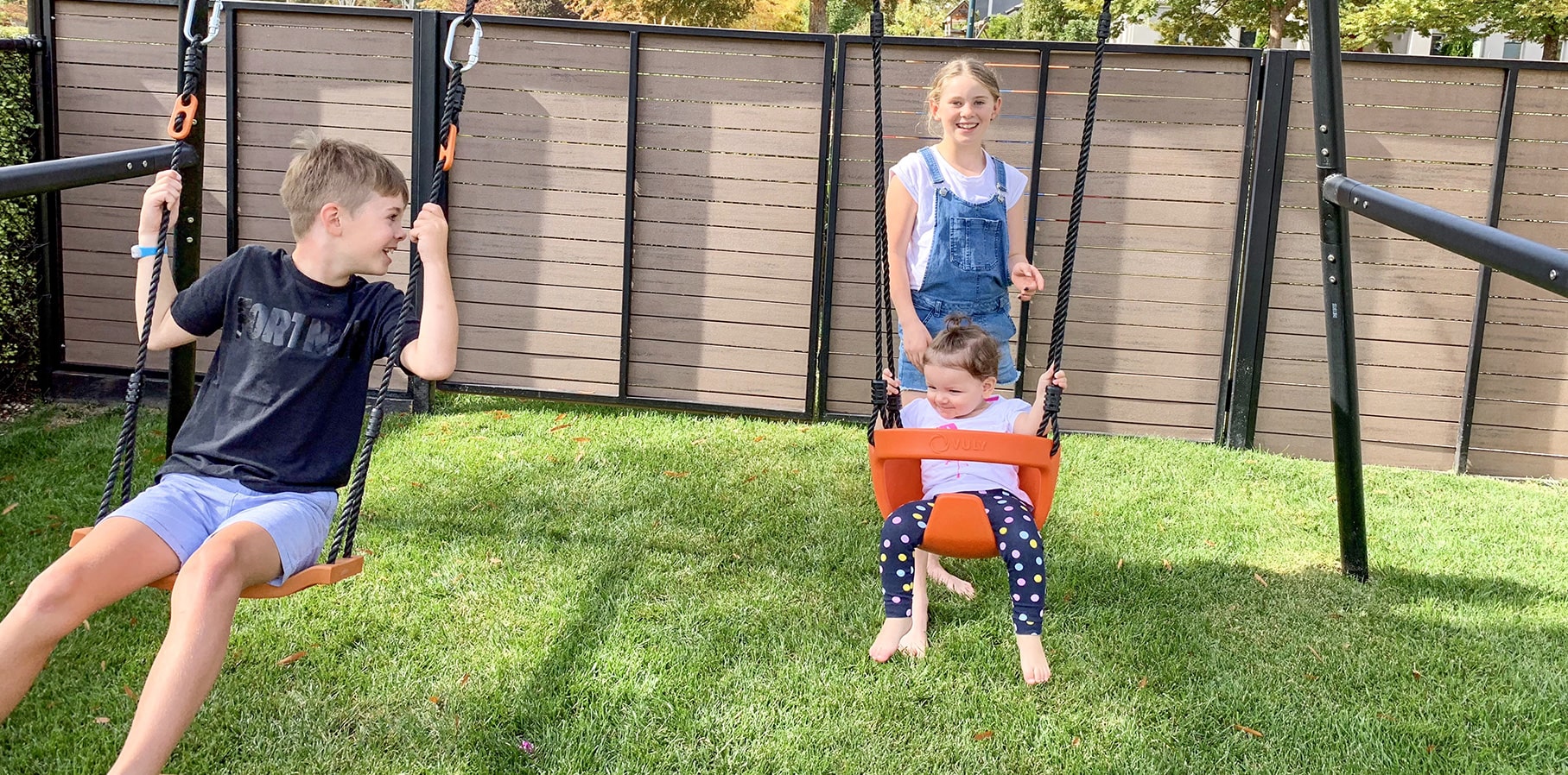 Two kids on Vuly 360 Pro Swing Set