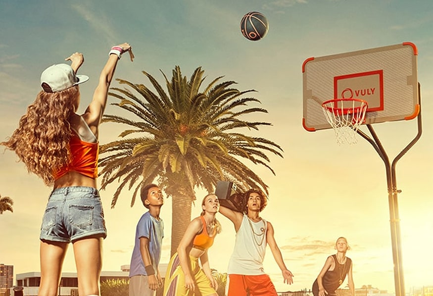 Kids playing basketball outdoors on a Vuly Slam Pro