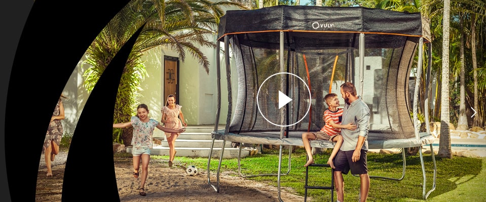 Dad and kids in front of their Vuly Play 10ft trampoline